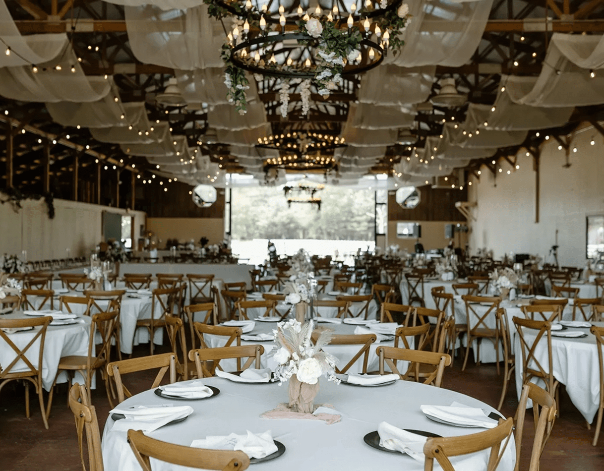 Rustic banquet setup with white tablecloths